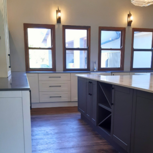 Country kitchen island with custom designed wine display cabinet