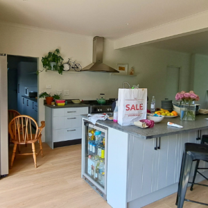 Kitchen island with incoporated under -counter bar fridge